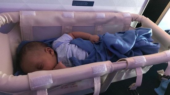 A baby sleeping in a crib
