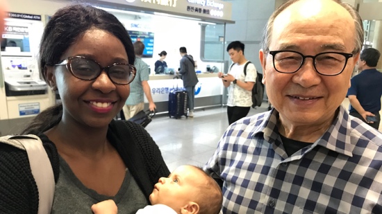A person and person holding a baby