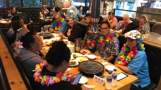 A group of people sitting around a table