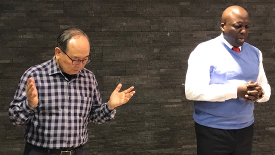 A person standing next to another person