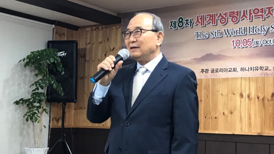 A person in a suit holding a microphone