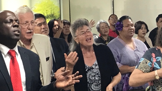 A group of people standing in a room