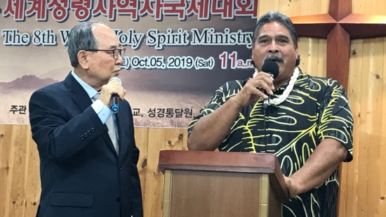 A person speaking into a microphone