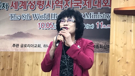 A person speaking into a microphone