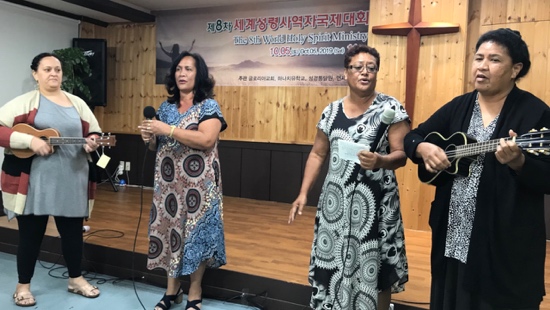 A group of people standing on a stage
