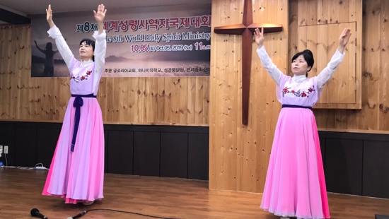 Two women in pink dresses