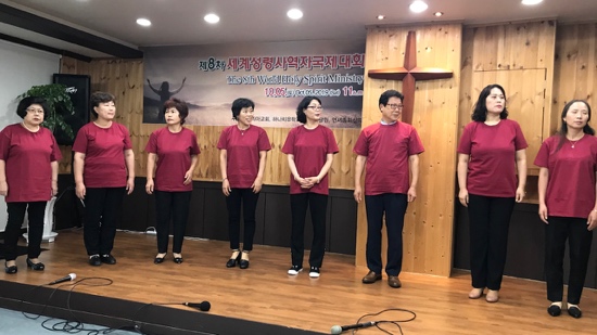 A group of people performing on a stage