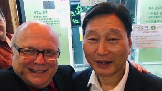 Two men smiling for a selfie