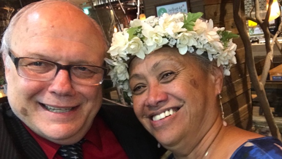 A person and person smiling for a picture