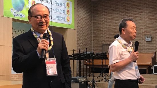 A person in a suit holding a microphone
