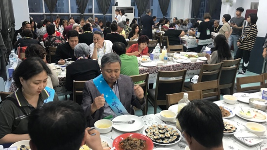 A group of people eating at a table