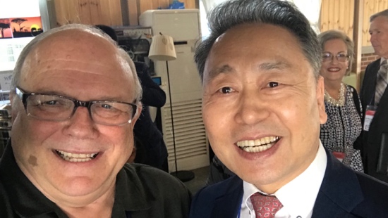 Two men smiling for a selfie