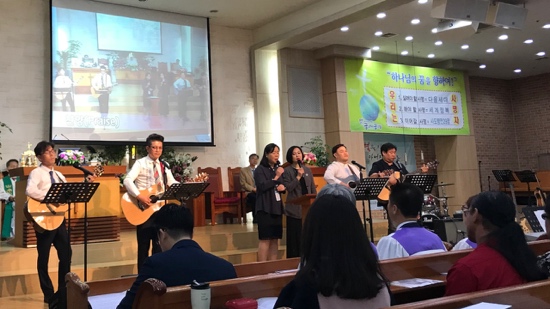 A group of people playing instruments in a room