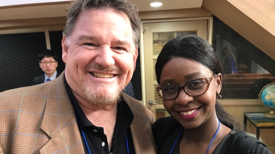 A person and person smiling for a picture