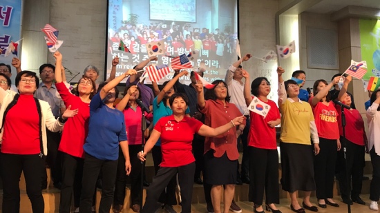 A group of people holding flags