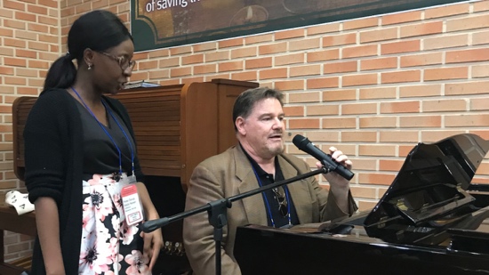 A person speaking into a microphone