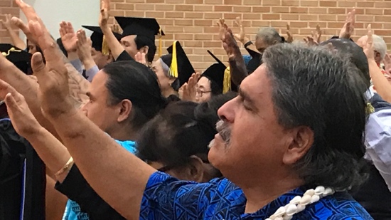 A group of people in graduation gowns