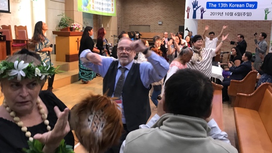 A group of people dancing in a room