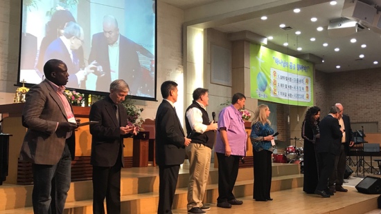 A group of people standing on a stage