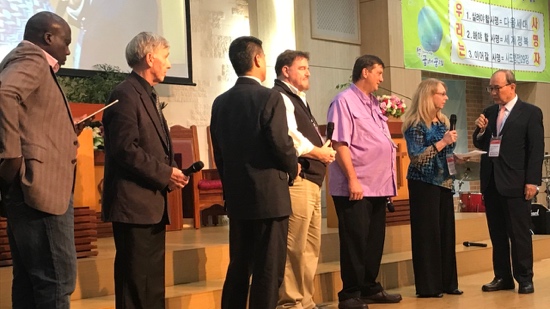 A group of people standing on a stage