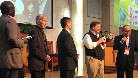 A group of men standing on a stage