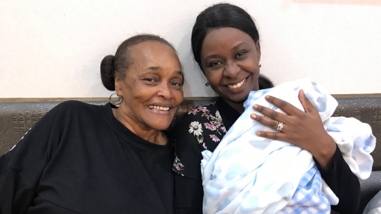 A person holding a baby