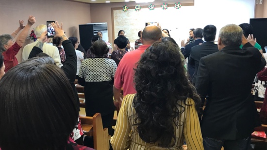 A group of people standing in a room