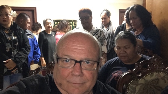 A person taking a selfie with other people