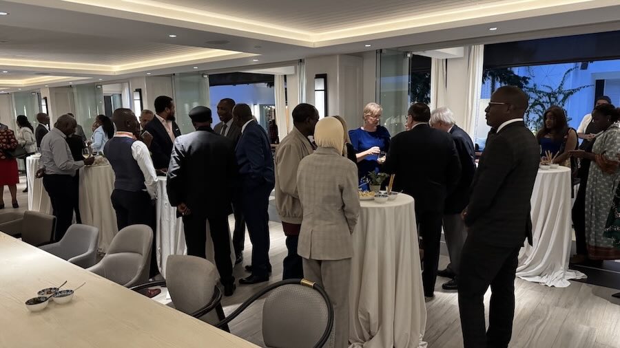 A group of people standing around a table