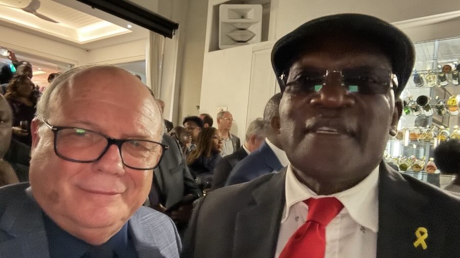 Two men in suits and glasses