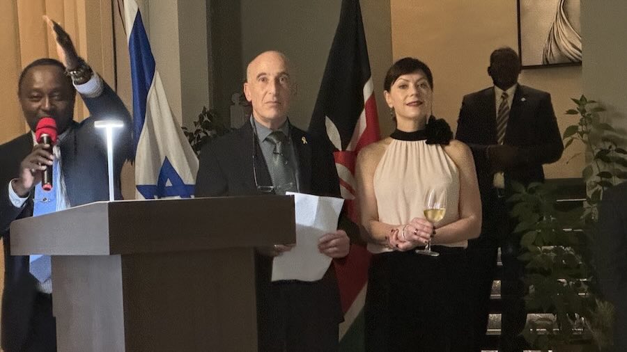 A person and person standing at a podium