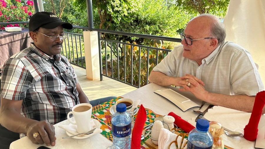 Two men sitting at a table