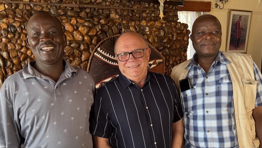 A group of men smiling