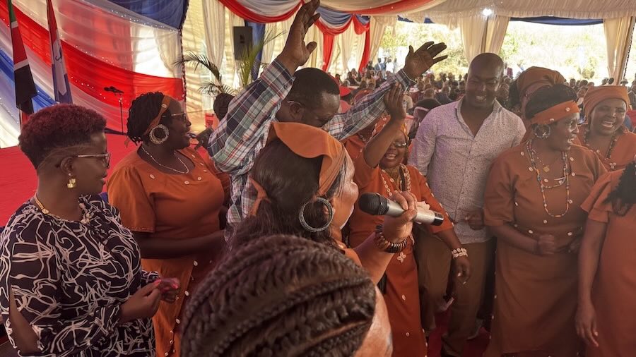 A group of people in orange outfits