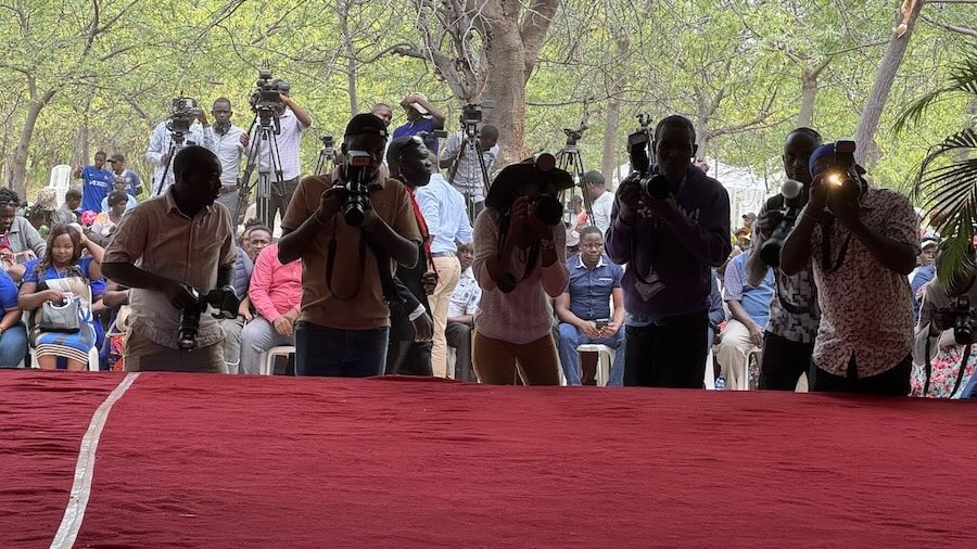 A group of people holding cameras