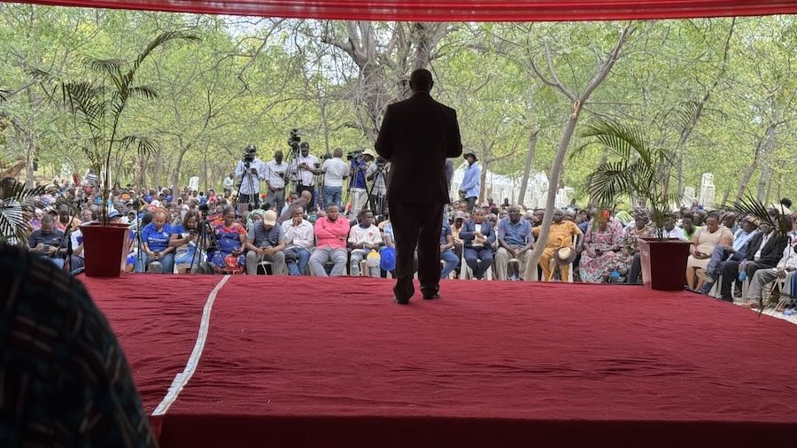 A person walking on a red stage
