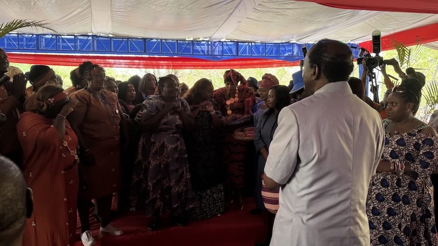 A group of people standing in a tent