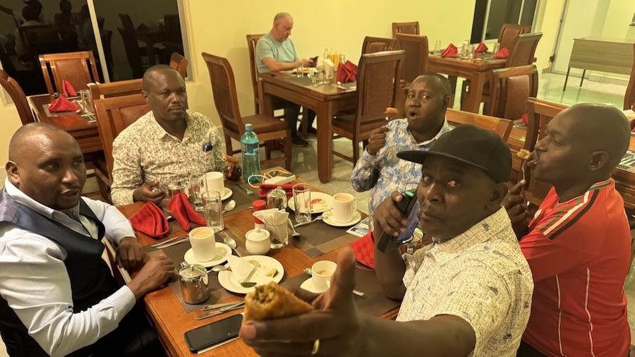 A group of men sitting at a table