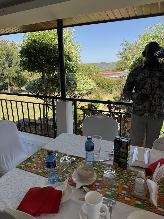 A table with plates and water bottles on it