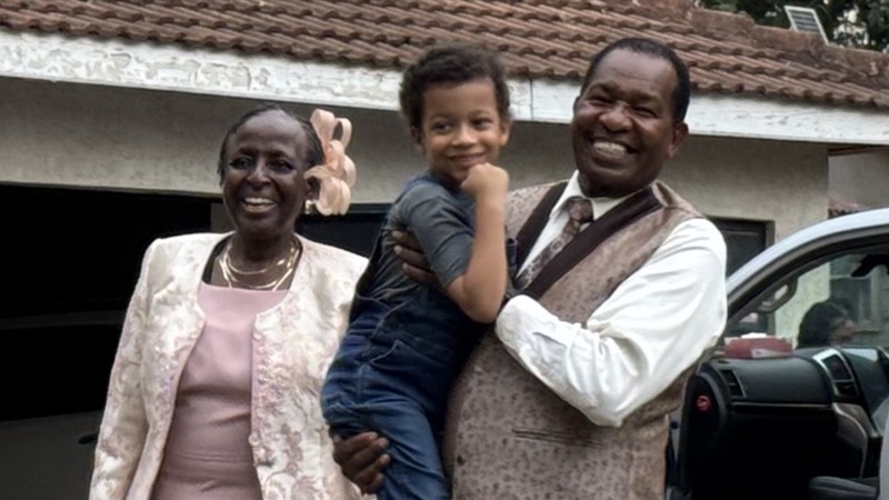 A person and person holding a child