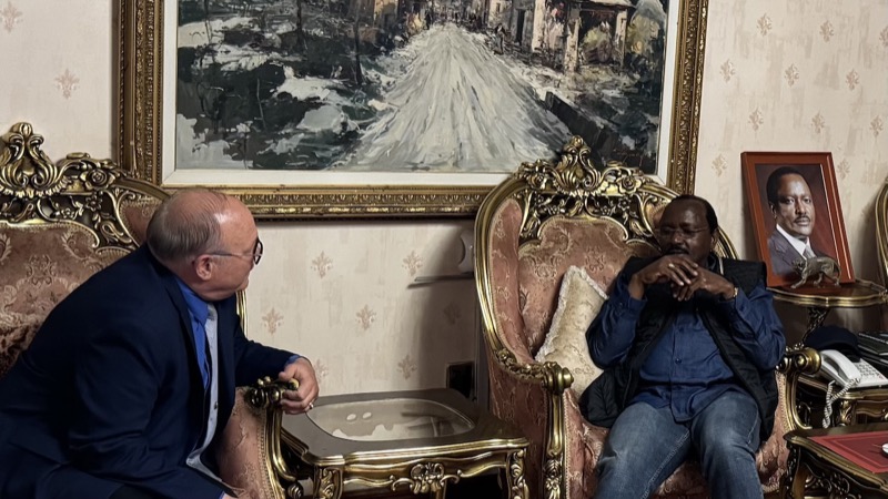 Two men sitting in chairs