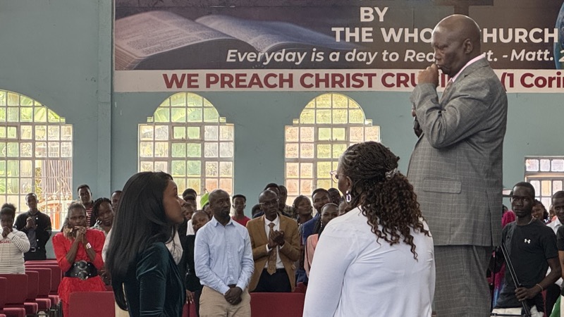 A person speaking to a group of people
