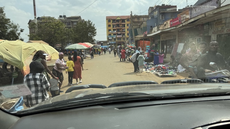 A group of people walking on a street
