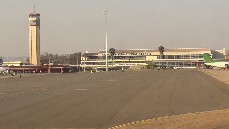 A large empty runway with a building in the background