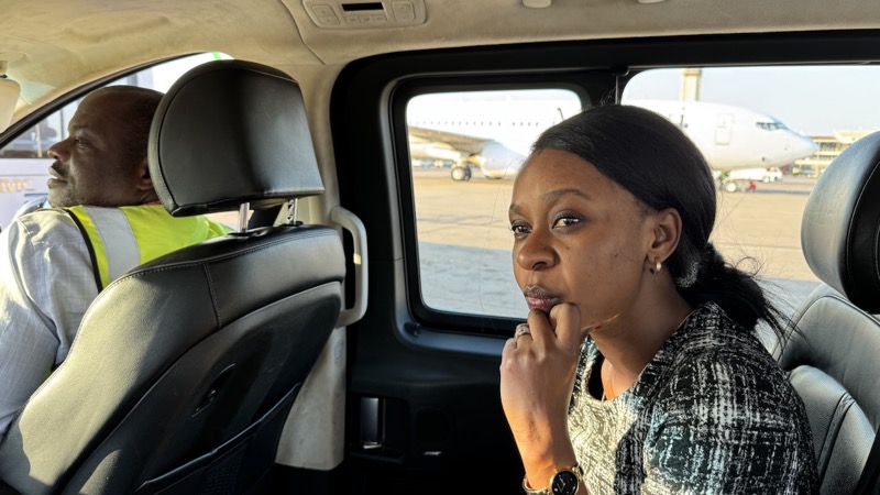 A person sitting in a car