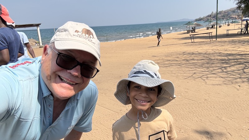 A person and child on a beach