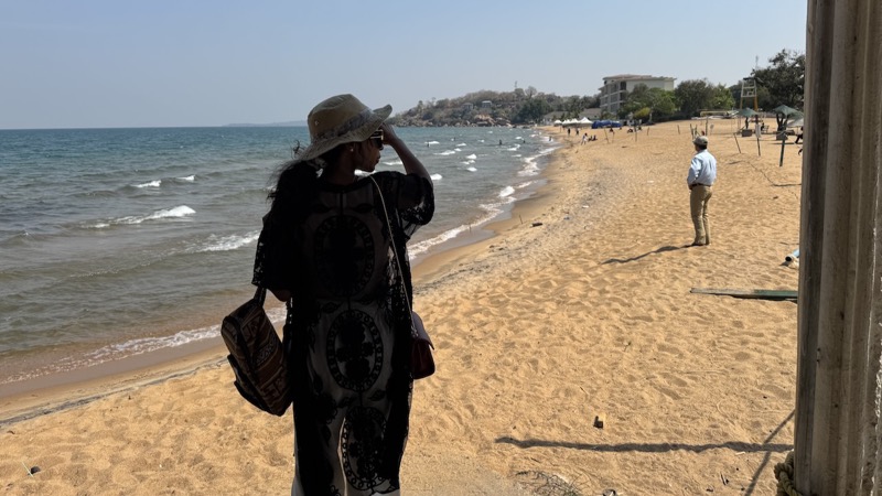 A person in a hat on a beach