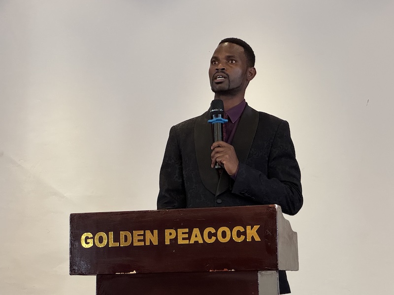 A person speaking into a microphone