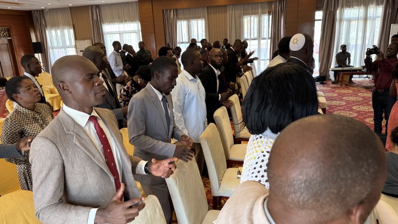 A group of people standing in a room