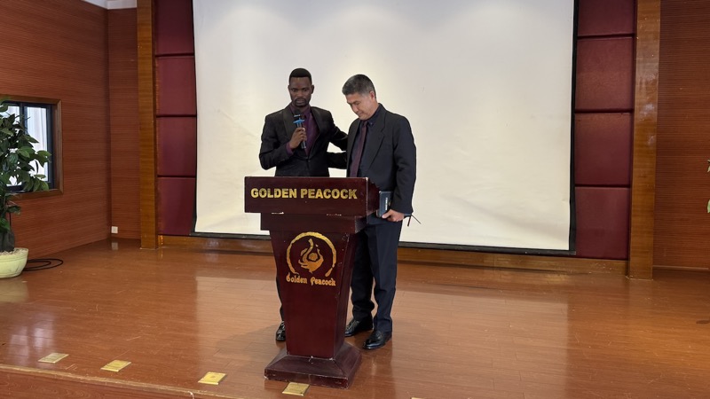 Two men standing at a podium